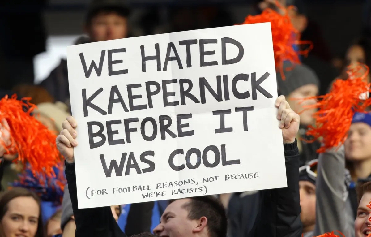 Image of NFL fans holding up a sign reading "We hated Kaepernick before it was cool"